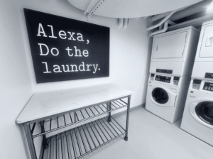 funny sign in laundry room of apartment building